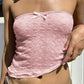 Top a fascia rosa con motivo fiocco dolce