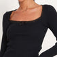 Top in maglia a maniche lunghe con finiture in pizzo nero classico e scollo rotondo