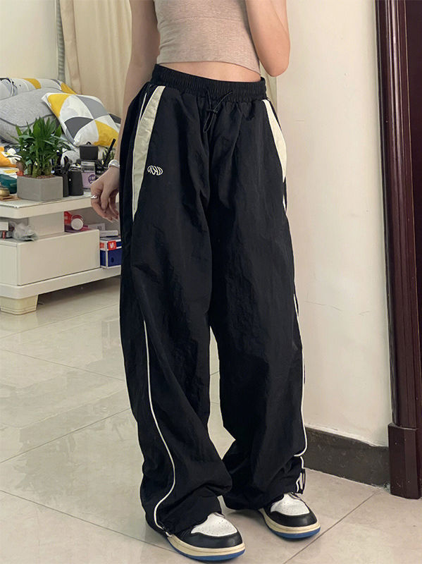 Schwarze Baggy Oldschool Sweatpants mit Kontrast Paspeln