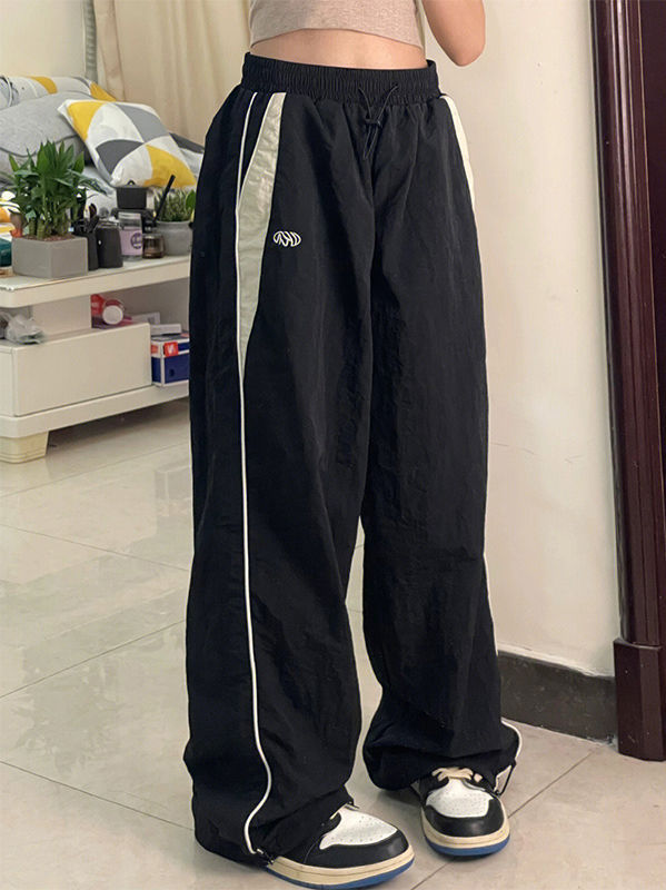 Schwarze Baggy Oldschool Sweatpants mit Kontrast Paspeln