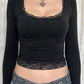 Black long sleeve crop top with square neckline and lace trim