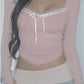 Vintage pink knit top with square neckline and lace insert