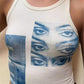 White crop tank top with Staring Eye graphic