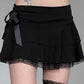 Black tiered mini skirt with lace bow