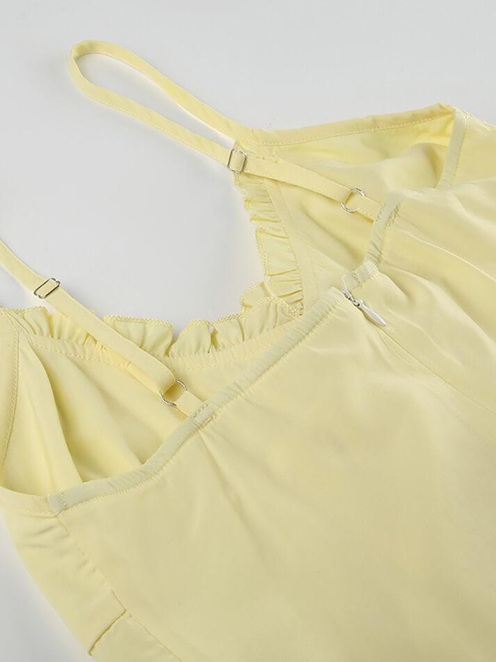 Top giallo vintage con scollo a V e volant sull'orlo