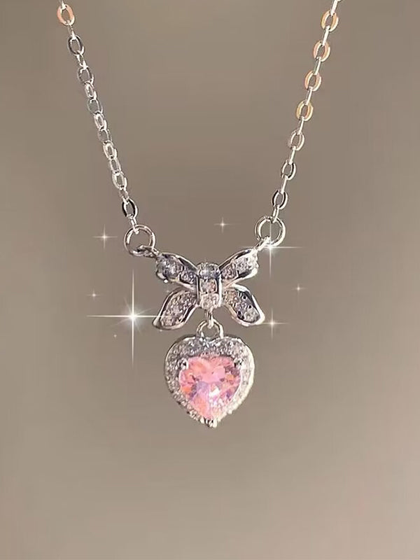 Collana con ciondolo a forma di cuore con fiocco glitterato rosa Y2K