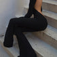 Black vintage jumpsuit with long sleeves and flared legs