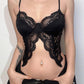 Top a corsetto con spacco e scollo a V in pizzo nero sexy