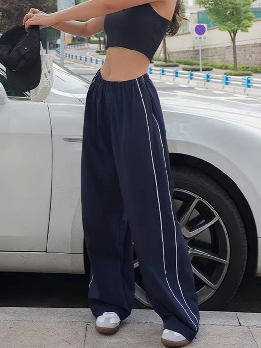 Pantaloni larghi sportivi retrò blu navy con strisce