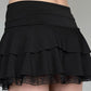 Black tiered mini skirt with lace bow