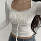 White vintage long-sleeved shirt with lace trim and binding