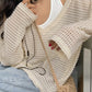 White vintage cut out knitted sweater with loose fit and V neck