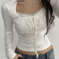 White vintage long-sleeved shirt with lace trim and binding