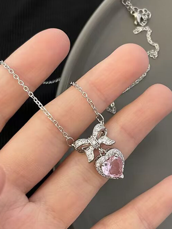 Collana con ciondolo a forma di cuore con fiocco glitterato rosa Y2K