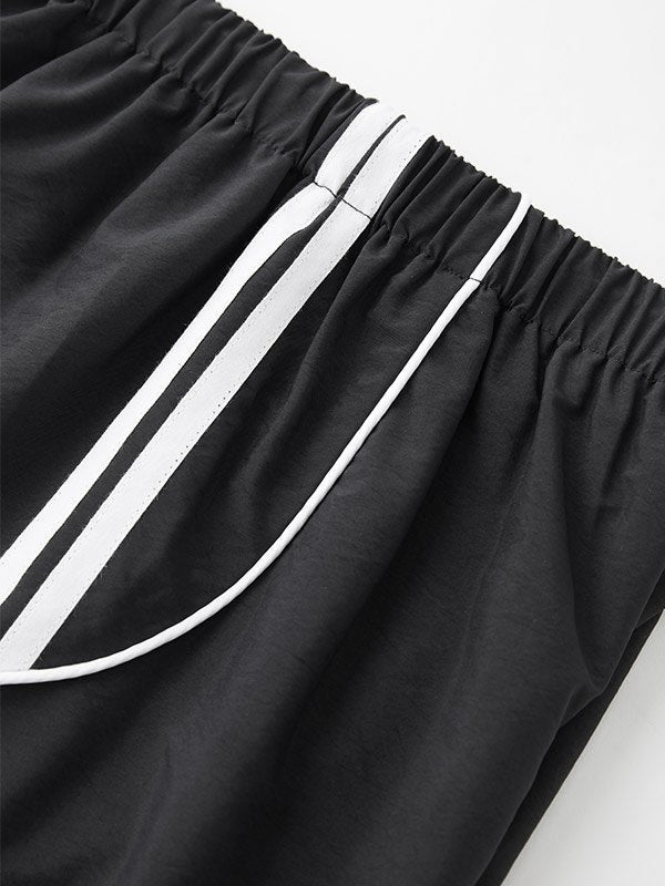 Pantaloni da jogging larghi neri sportivi retrò con strisce laterali