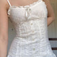 White vintage camisole with buttons and embroidered lace