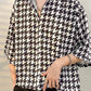 Black vintage men's shirt in houndstooth pattern with button placket