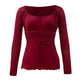 Top a maniche lunghe rosso vintage con finiture in pizzo