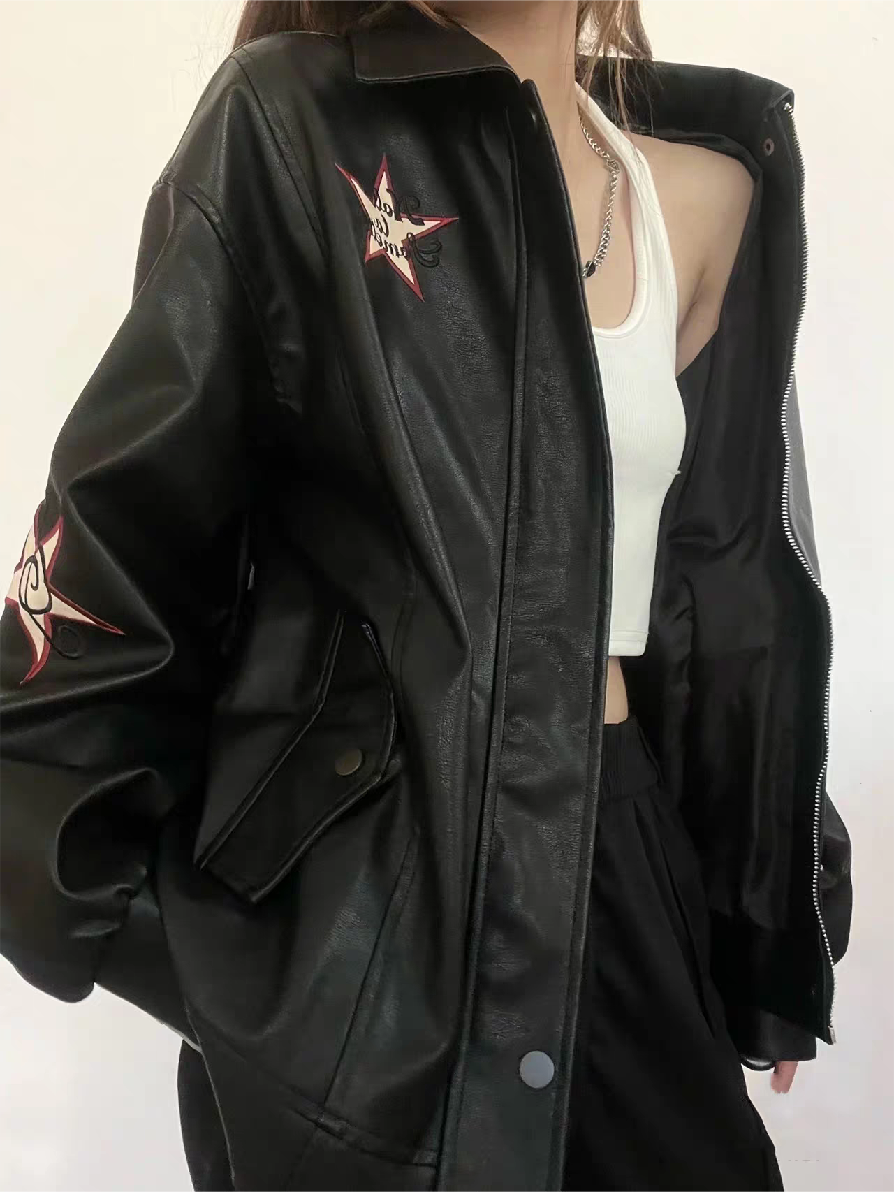 Black leather jacket with lapel collar and embroidery